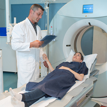 a woman in the hospital MRI machine